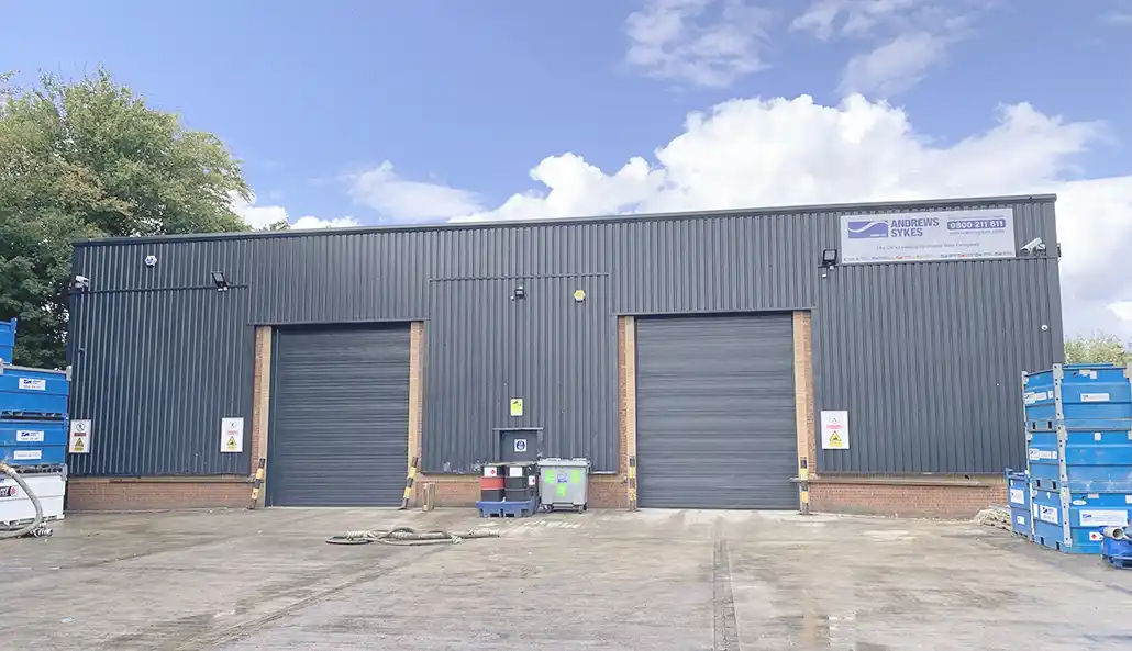 Andrews Sykes North West depot front view Front view of the Andrews Sykes North West depot in Irlam, Manchester, featuring large doors and customer access.